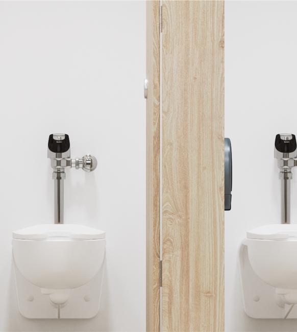 Two Sloan Solis 8111 Flushometer on top a ST-2459 water closets straight on